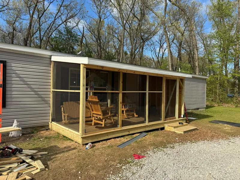 New screened porch with rocking chairs inside