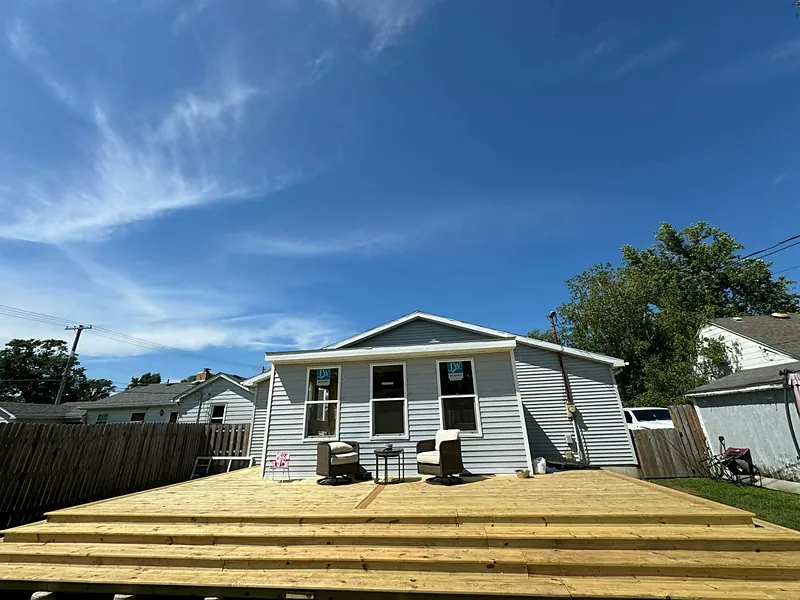 Finished addition with a wide wraparound deck